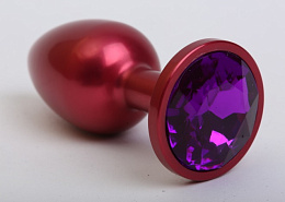 Анальная пробка из металла красного цвета с фиолетовым кристаллом